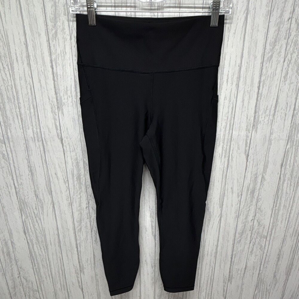 Womens Size M Athleta Interval Stash 7/8 Right Leggings Black EUC